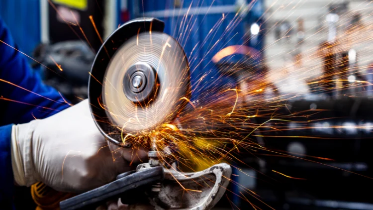 Angle grinder cutting metal