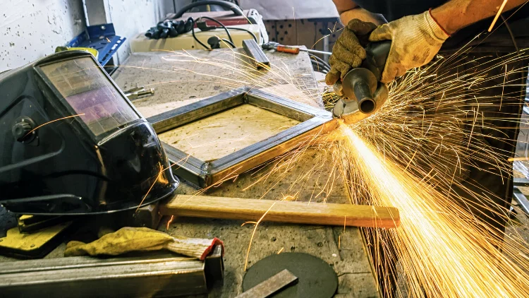 Angle grinder grinding on metal